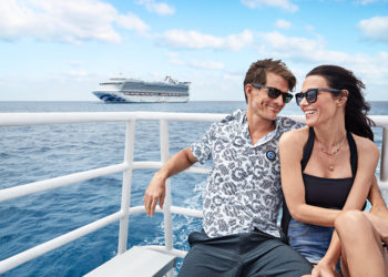 Couple on a boat with Princess Cruises chip in the background